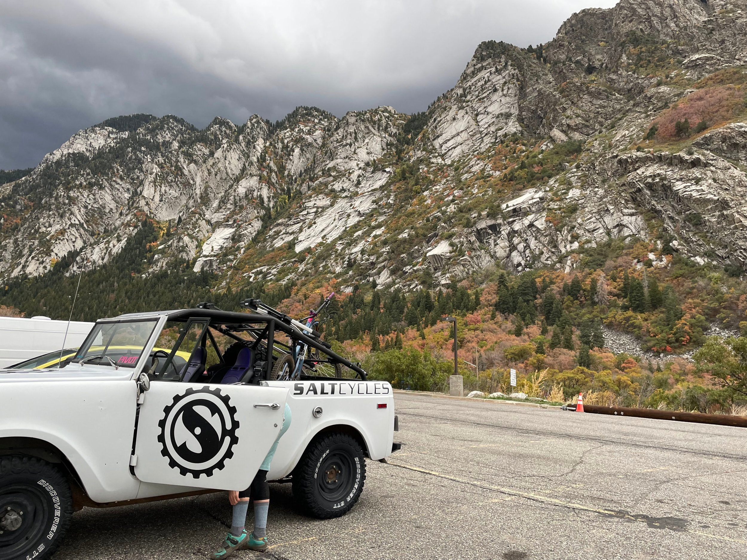 White off-road vehicle with Salt Cycles logo on a mountain road